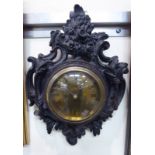 An early 20thC cartel design hanging timepiece with an asymmetrically floral and foliate scroll