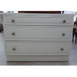 A modern white painted three drawer dressing chest,