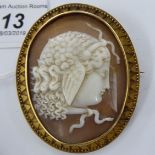 A yellow metal backed oval cameo brooch 11