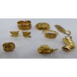 Egyptian yellow metal items of personal ornament: to include earrings,
