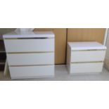 A modern white painted and laminated three drawer dressing chest,