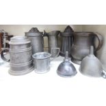 'Antique' pewter: to include two similar jelly moulds with covers;