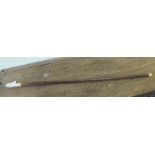 An early 20thC walking cane, the tapered wooden shaft with a turned, waisted ivory handle,