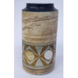 A Troika pottery cylinder vase, decorated in tones of brown,