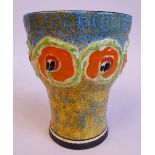 A Clarice Cliff Bizarre Nuage pottery cup shaped vase with a decoratively moulded frieze of