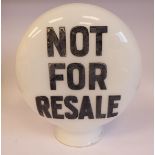 A 'vintage' opaque white glass petrol pump globe of flattened spherical form with a waisted neck