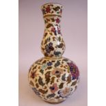 A Josef Steidl Znaim gourd shaped porcelain vase, decorated in colours with crisp,