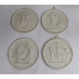 A set of four Royal Copenhagen relief moulded, bisque porcelain wall plaques,