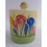 A Clarice Cliff pottery conserve pot of drum design with a cover,