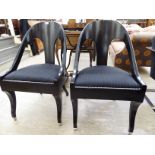 A pair of Ralph Lauren Beekman design black painted tub shaped, splat-back bedroom chairs,