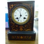 An Edwardian string and marquetry walnut cased mantel clock,