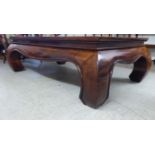 A mid 20thC Chinese elm coffee table,