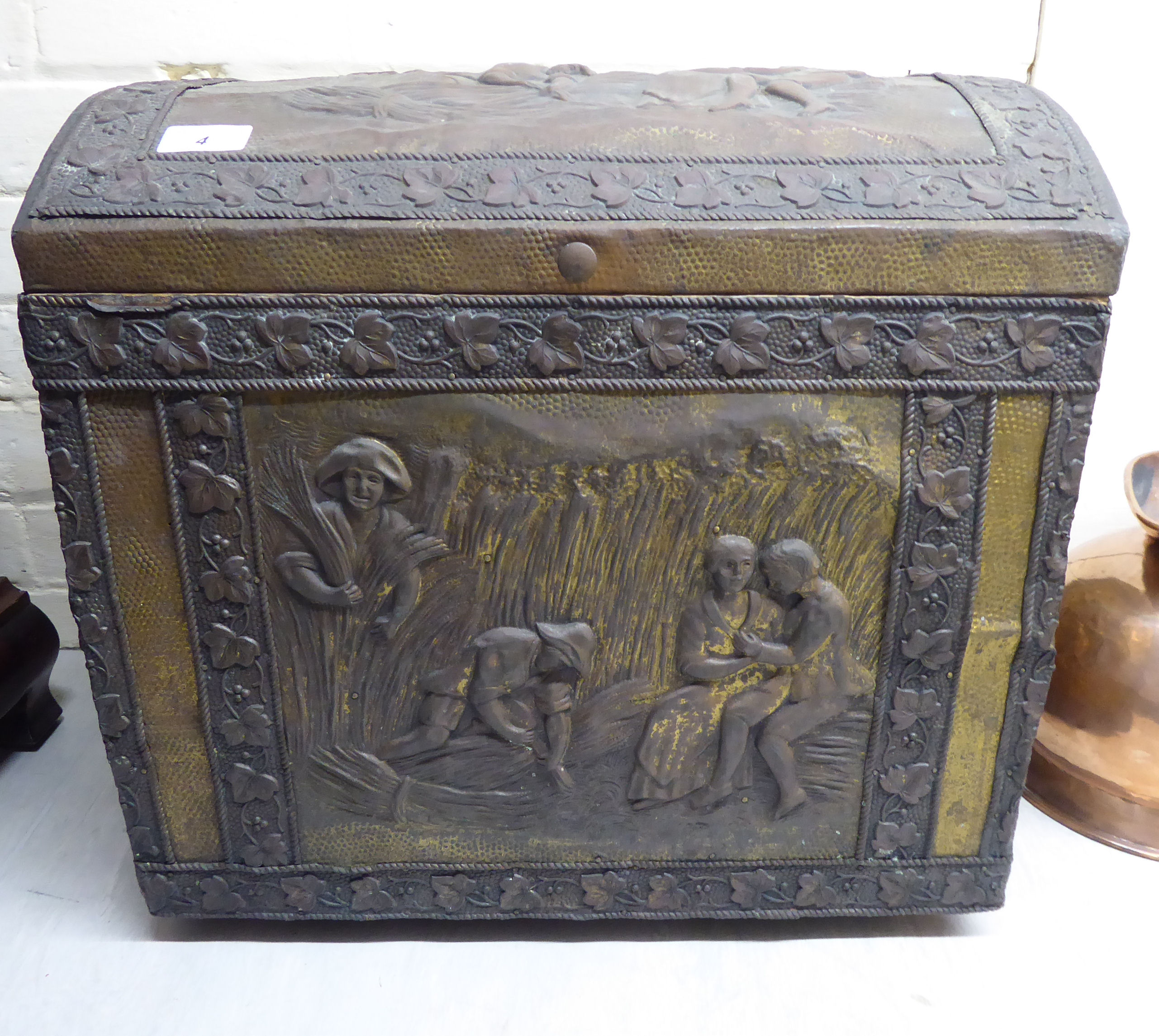 A mid 20thC brass covered pine coal bin with straight sides and a hinged domed lid,