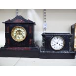 A late Victorian black slate and mottled iron red marble cased mantel clock with a pillow cornice