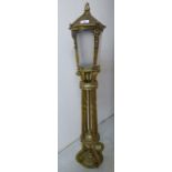 A modern brass framed freestanding lamp,