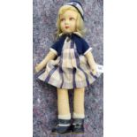 A 1930s Lenci type doll with painted, moulded felt features, wearing a bolero, dress,