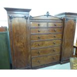 A late Victorian/Edwardian nine section triple wardrobe with a central back of two short/five long
