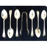 A set of six silver teaspoons with shell cast terminals;