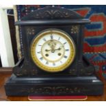 A 1930s black slate cased mantel clock,