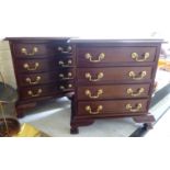 A pair of modern mahogany four drawer beside chests with brass bail handles,