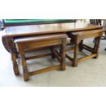 A nesting set of three Ercol Golden Dawn beech and elm occasional tables,