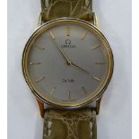 An Omega DeVille Quartz stainless steel and gold plated cased wristwatch, faced by a baton dial,