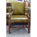 A modern Gainsborough style mahogany finished desk chair, stud upholstered in green hide,