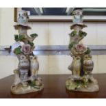 A pair of early 20thC (possibly Bavarian) china candlesticks,