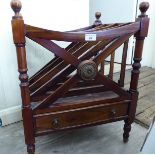 A modern mahogany finished four division Canterbury with a drawer,