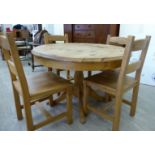 A modern pine extending dining table,