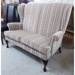 A modern Georgian style two person wingback settee, the patterned fabric,