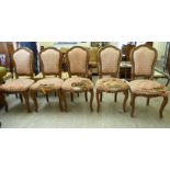 A set of five 20thC French stained beech framed, high back chairs, stud upholstered in patterned,