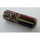 A white metal lipstick holder with multi-coloured enamelled decoration 11