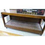 A 1960/70s teak finished hostess trolley with an articulated arm, raised on splayed,