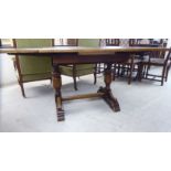 A 1930s oak draw leaf dining table,