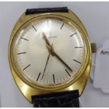 A Zenith Sil stainless steel and gilt cased wristwatch with a silver coloured baton dial,