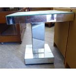 A modern bevelled mirrored, pedestal lamp table, on a square box base plinth 21''h 19.