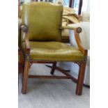 A modern Gainsborough design mahogany finished desk chair, stud upholstered in green hide,