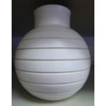 A Keith Murray ivory coloured pottery vase of bulbous form, having a wide,