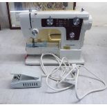 A Newhome electric sewing machine,