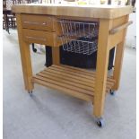 A modern T&G stained beech butcher's block/work station with an arrangement of drawers and racks,