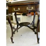 An Edwardian mahogany envelope card table with a frieze drawer, raised on cabriole legs and casters,