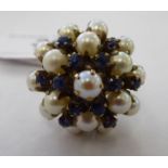 A yellow metal claw set sapphire and pearl cluster dress ring 11
