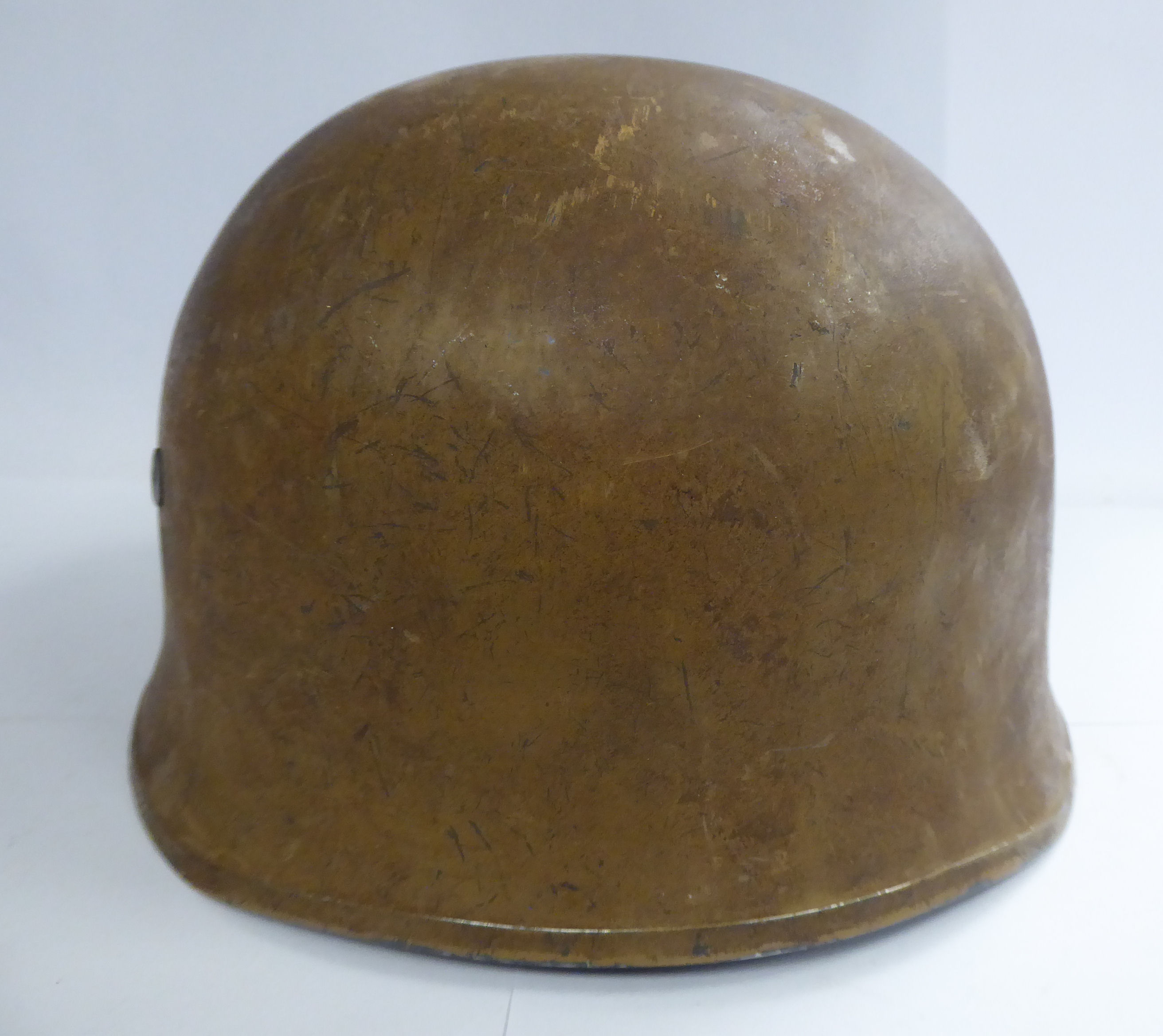 A German brown painted parachutist's helmet with a hide lining and chinstrap (Please Note: this - Image 2 of 8