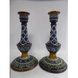 A pair of late 19thC Doulton Burslem stoneware candlesticks,