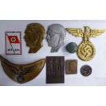 Nazi related artefacts: to include two similar profile portrait plaques, depicting Adolf Hitler,