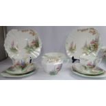 A Shelley china tea set, decorated with pedestal urns and English garden flowers (No.