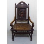 A late 19thC Puritan inspired oak framed hall chair,