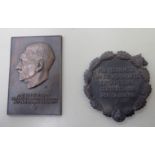 A bronze finished cast iron profile portrait plaque,