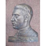 A bronze finished cast iron profile portrait plaque,